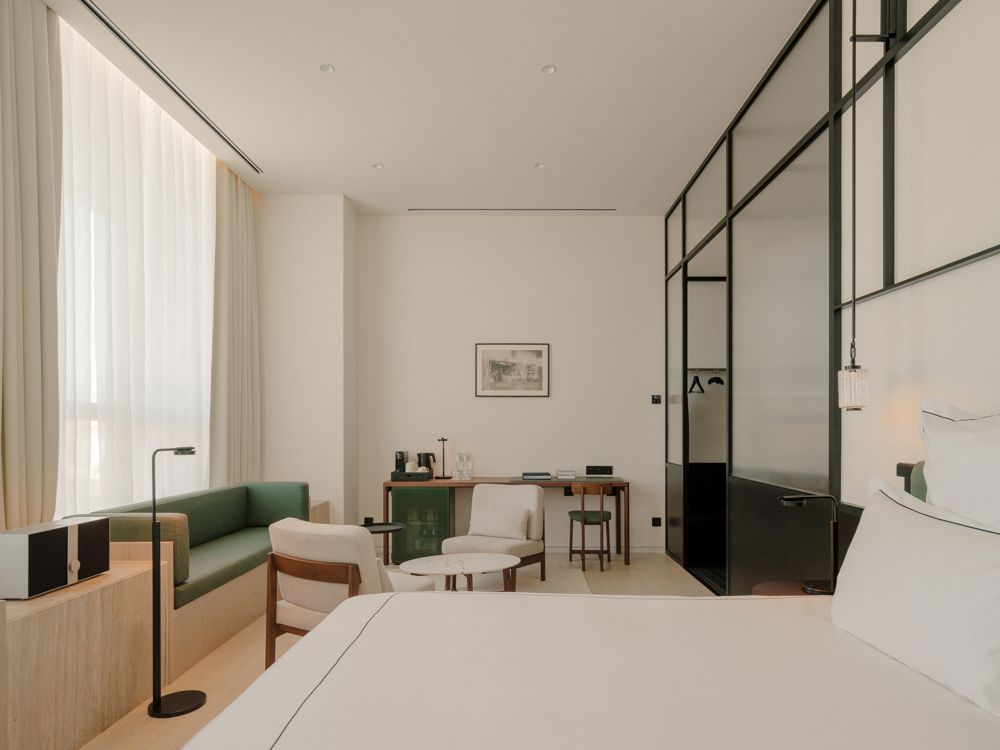 Modern Brutalist architecture softened by warm interior textures.