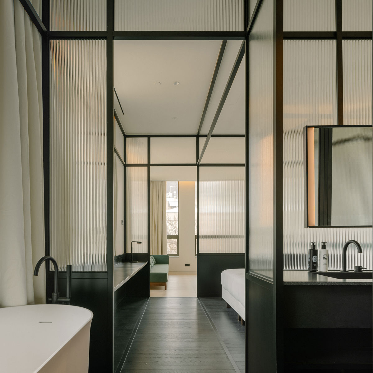 Deluxe guest room at The Telegraph Hotel Tbilisi with premium white linens.