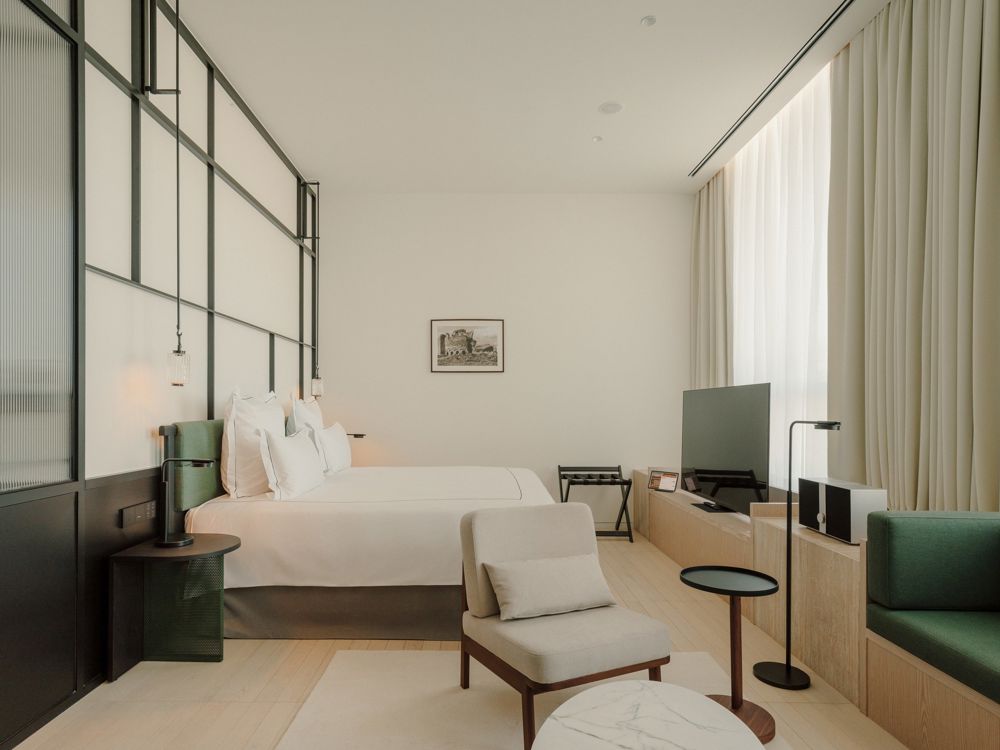 Refined industrial style guest room at The Telegraph Hotel Tbilisi.