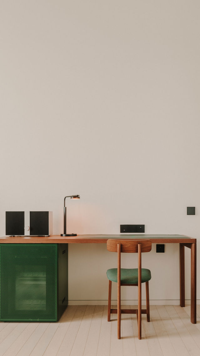 Restored brickwork and modern steel beams in the Executive corridor.