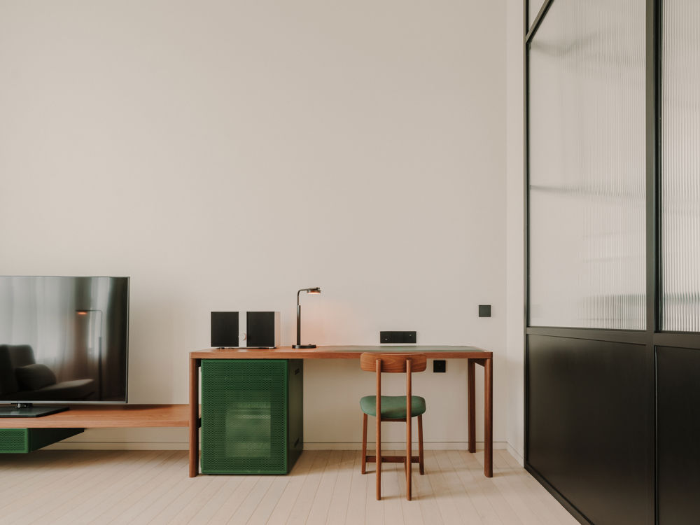 Restored brickwork and modern steel beams in the Executive corridor.