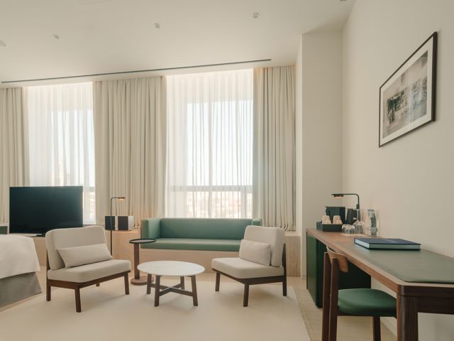 Tech-ready hotel room with easily accessible USB ports and smart controls.